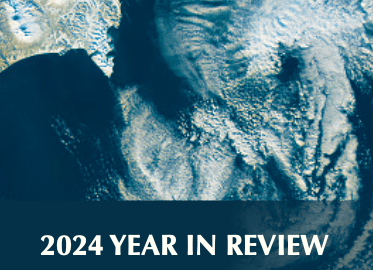 Satellite image of swirls of clouds over the ocean. Below the image, white text on a slightly transparent blue background reads "2024 Year in Review."